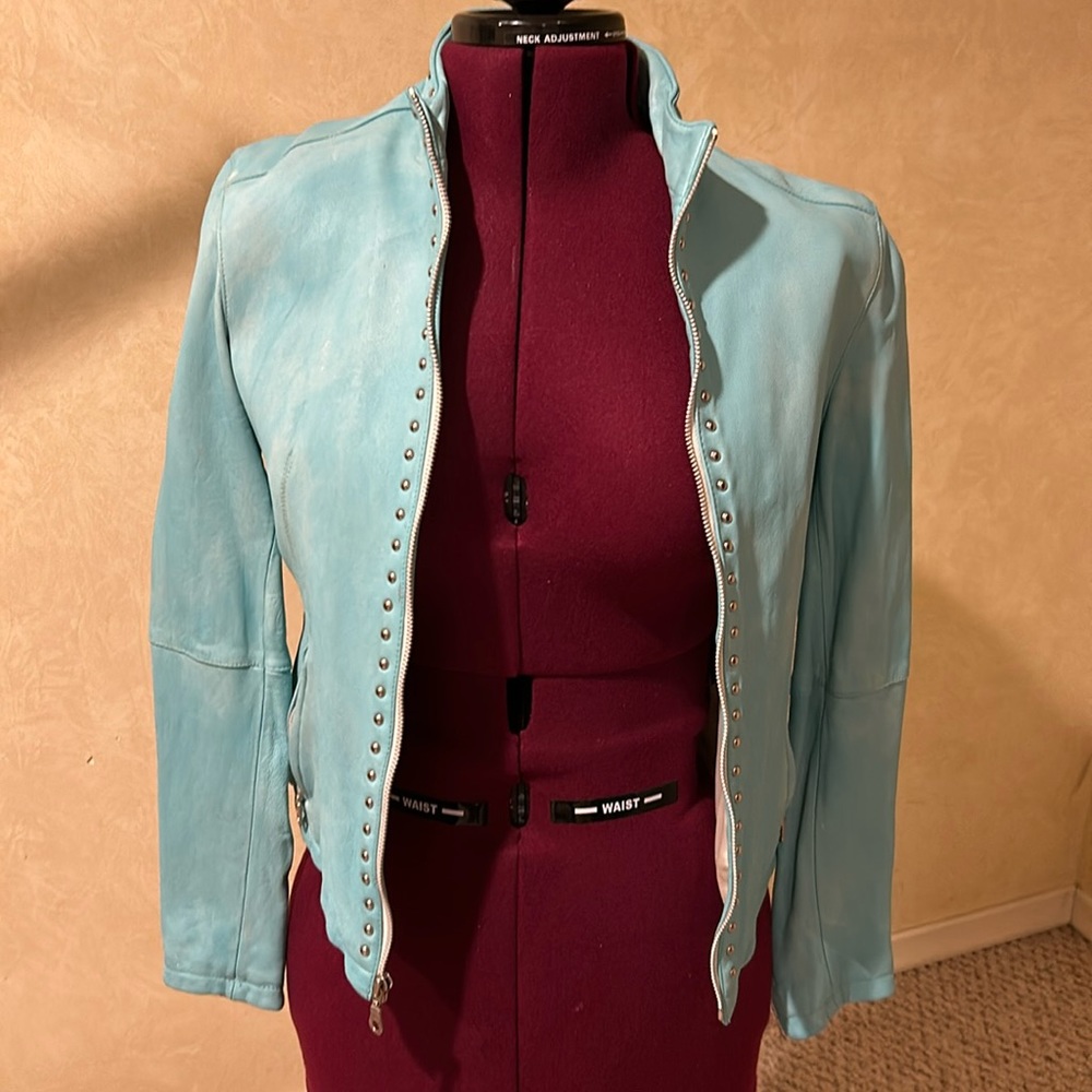 Women’s genuine Wilson’s Leather jacket, sky blue and white, size large.